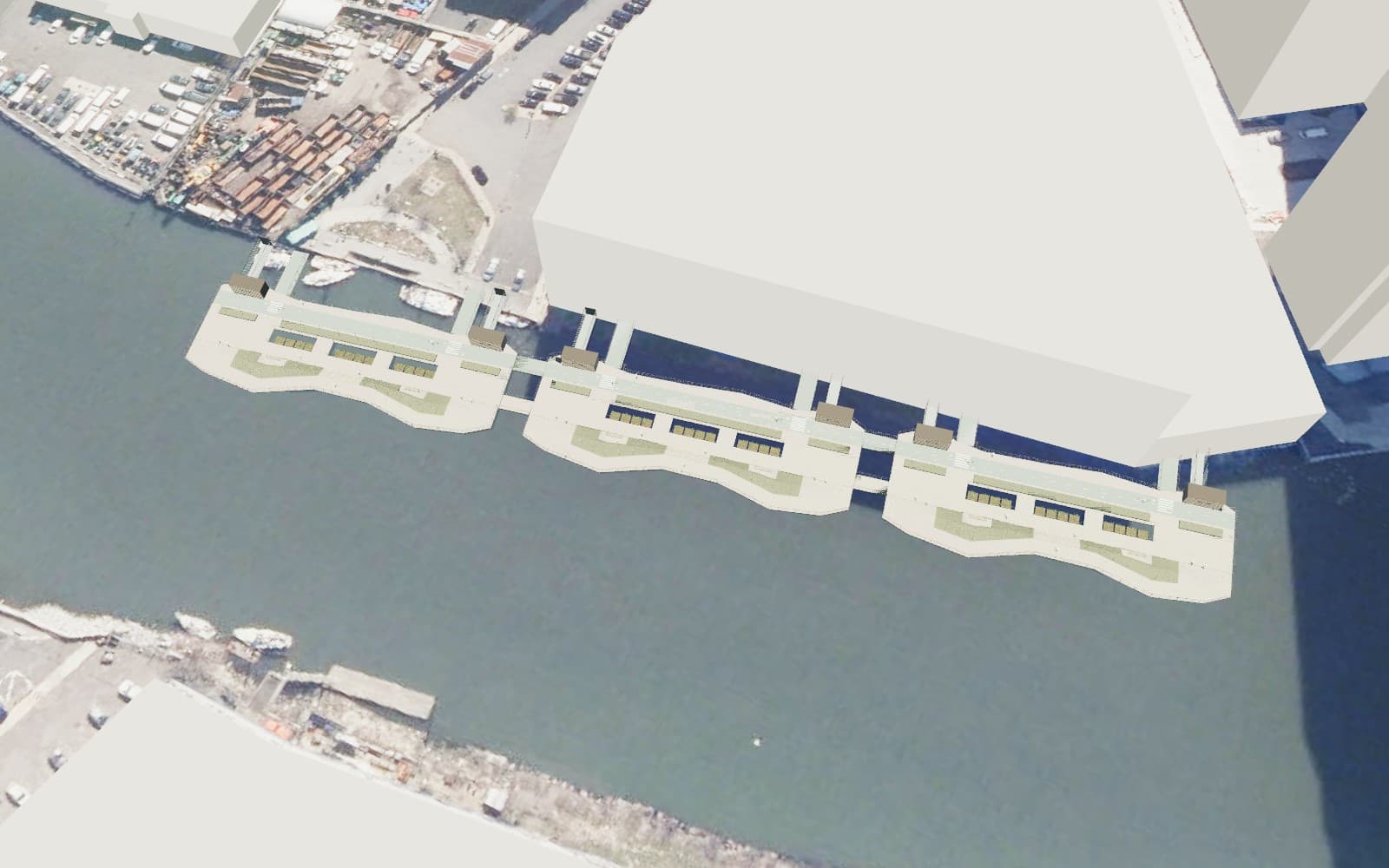 Three linked floating DataBarge sections along the Brooklyn bank of Newtown Creek
