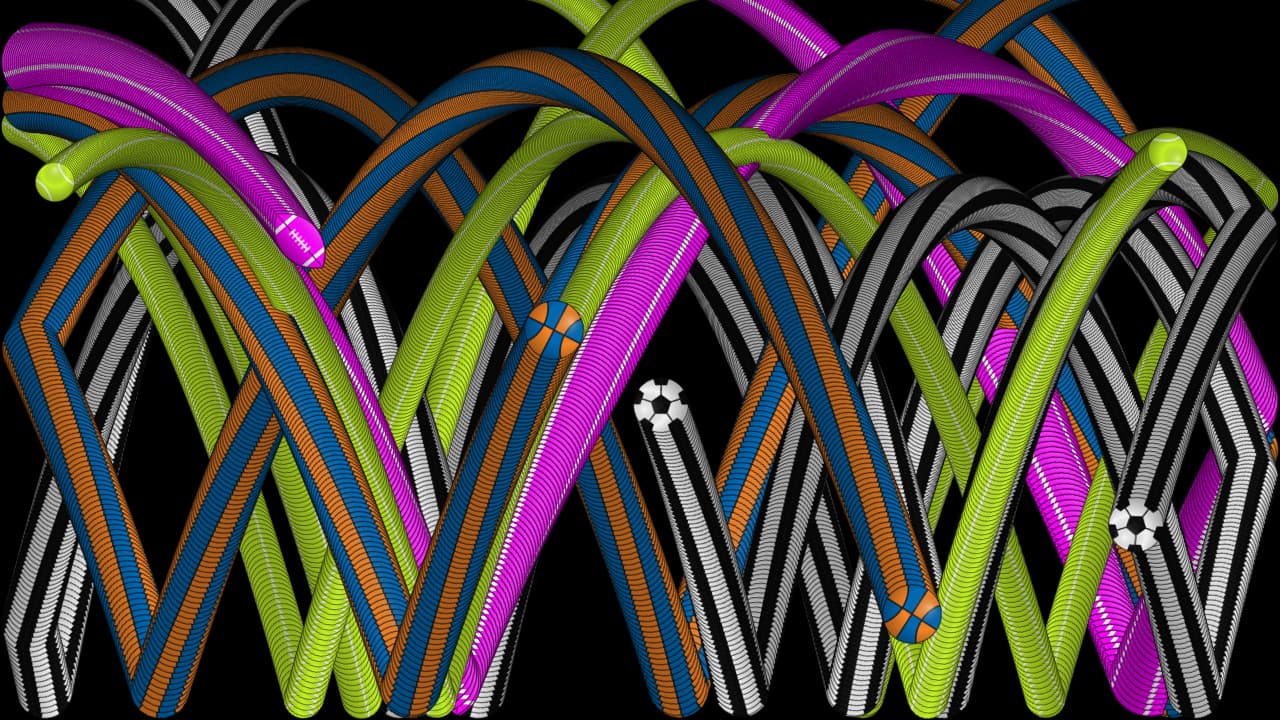Colorful ball trails crossing and accumulating on a black screen